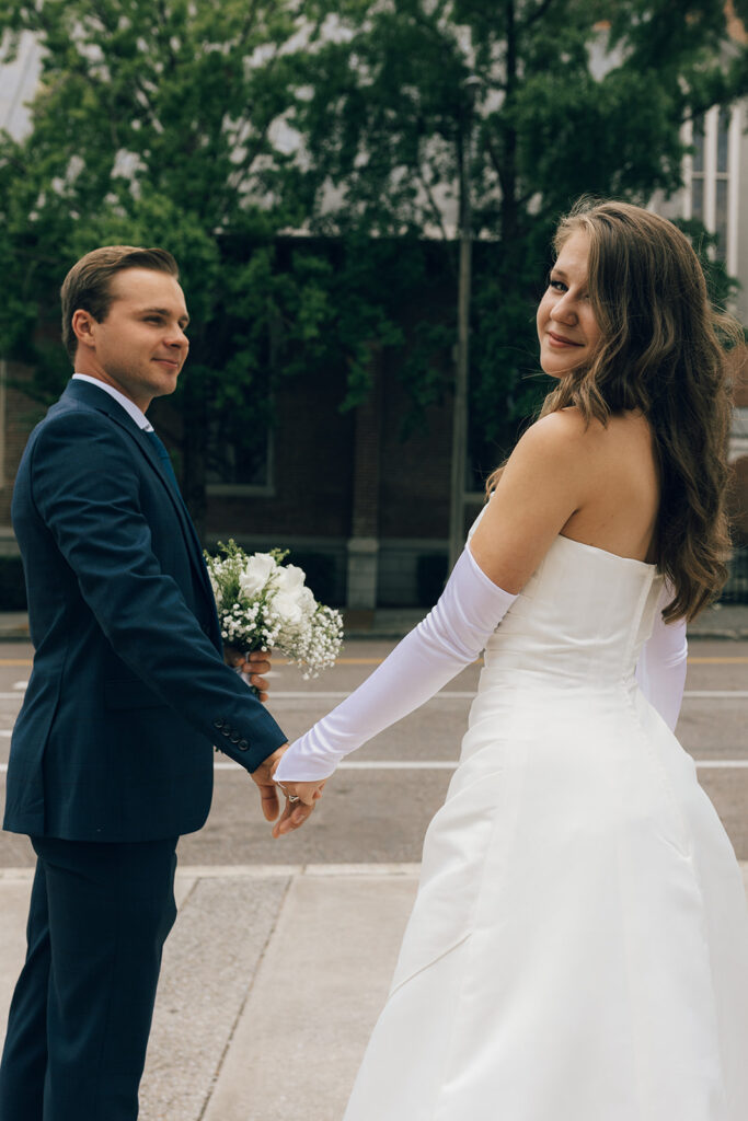 Couple holding hands in Downtown Memphis, TN