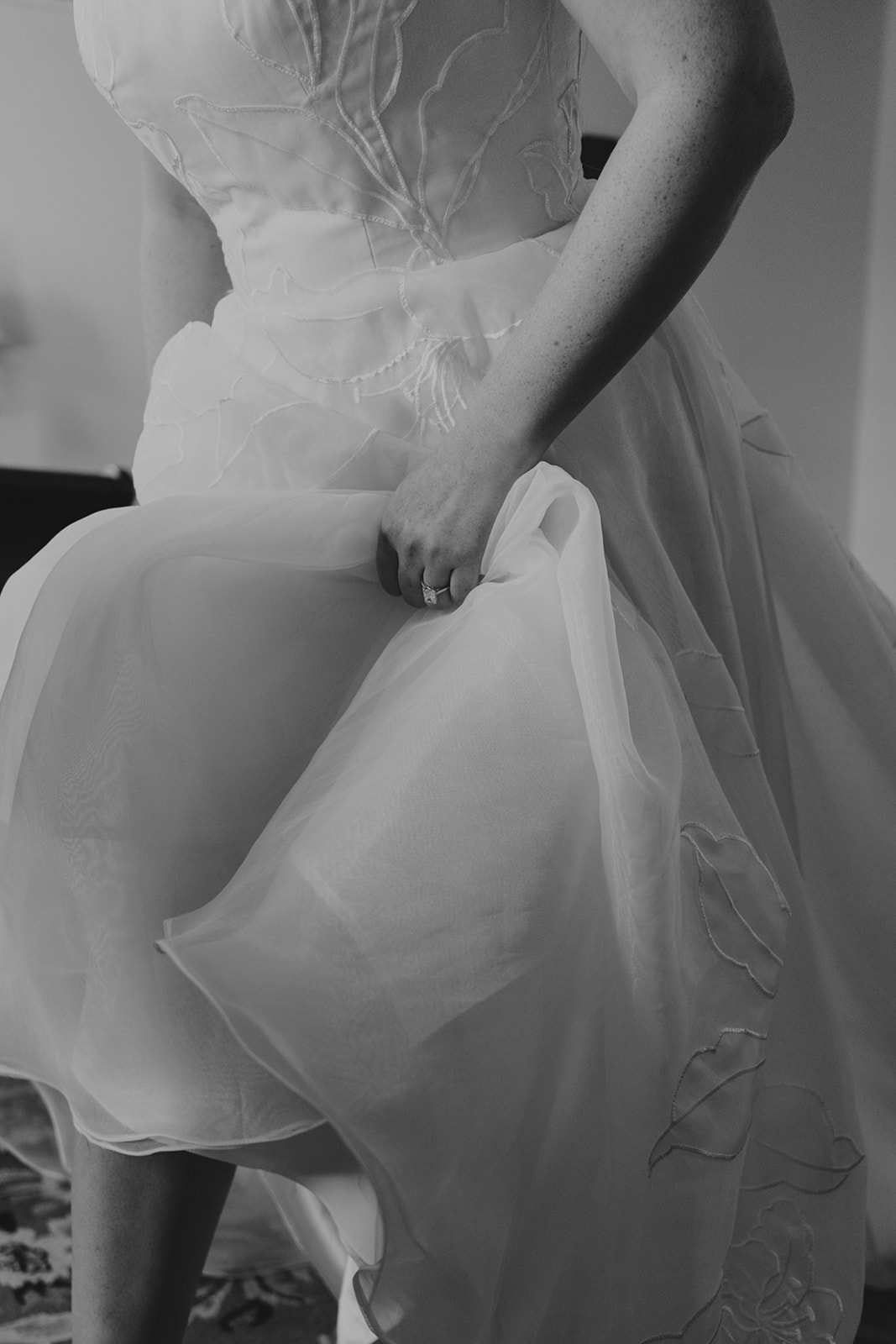 candid moment of bride walking during the Heartwood Hall reception