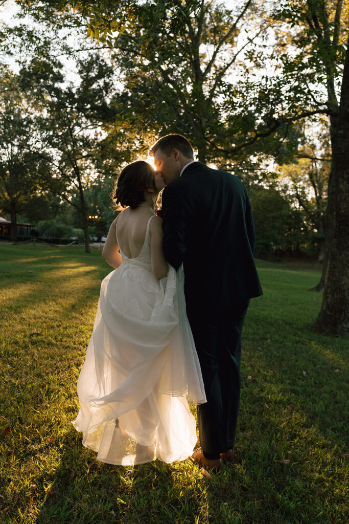 bride and groom being affectionate at Heartwood Hall wedding in Rossville, TN
