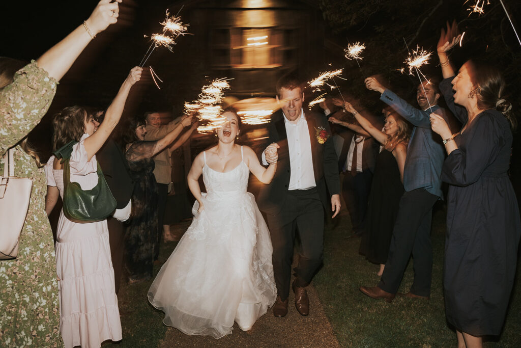 bride and groom leaving wedding venue at Heartwood Hall wedding in Rossville, TN