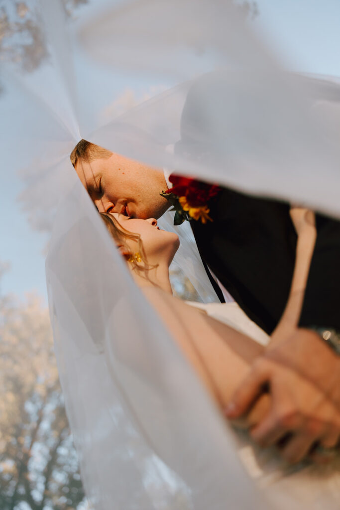 bride and groom being affectionate at Heartwood Hall wedding in Rossville, TN