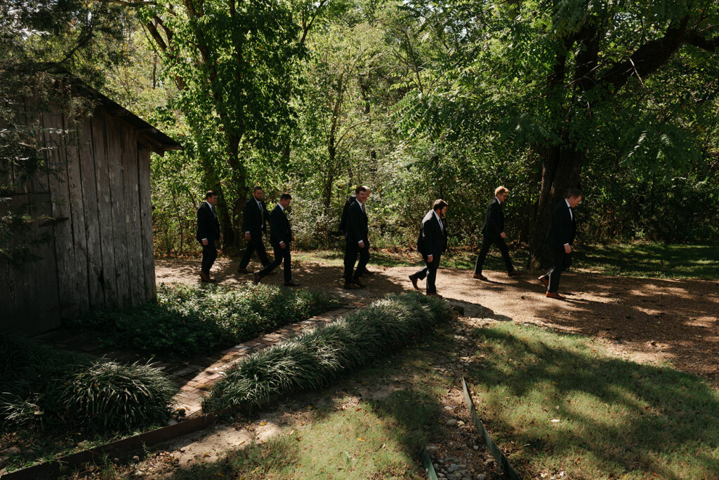 groomsmen walking Dancing man at Heartwood Hall wedding in Rossville, TN