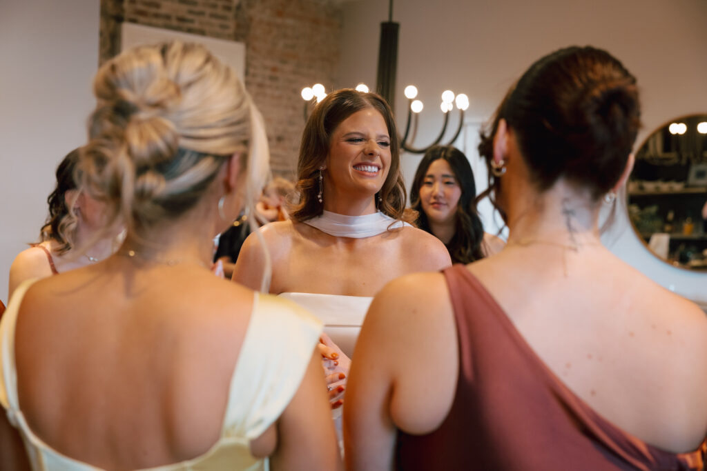 Bride laughing with bridesmaids at The Cordelle Nashville wedding